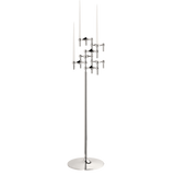 STOFF Nagel floor stand in chrome holding six original candle holders with white taper candles, a freestanding modular sculpture