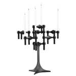 STOFF Nagel stand in black built up with modular holders into a full candle composition with lit tapers