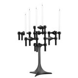 STOFF Nagel stand in black built up with modular holders into a full candle composition with lit tapers