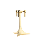 STOFF Nagel tabletop stand in solid brass, a single stemmed stand holding three taper candles