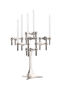 STOFF Nagel stand in chrome built up with modular holders into a full candle composition with lit tapers