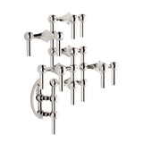 STOFF Nagel chrome wall hanger with modular candle holders built into a tall vertical arrangement, holding taper candles