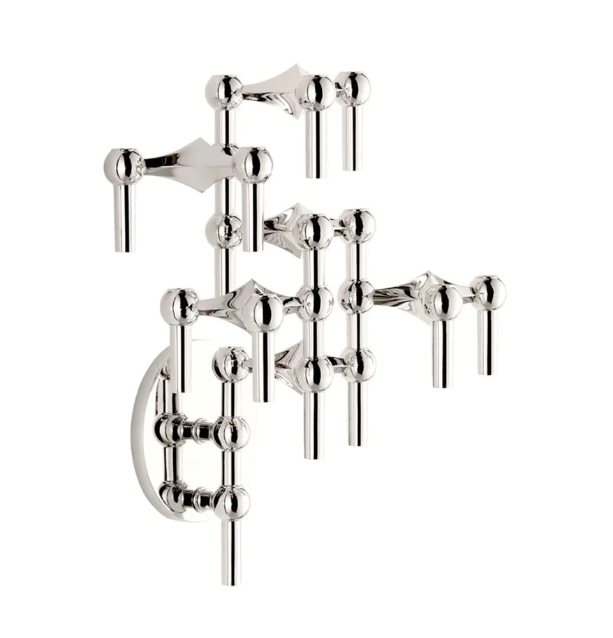STOFF Nagel chrome wall hanger with modular candle holders built into a tall vertical arrangement, holding taper candles