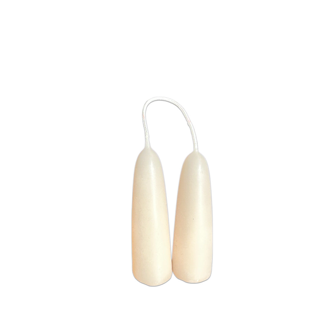 Hand-dipped stubby beeswax taper candles in birds milk, crafted with plant-based pigments for a luxurious look