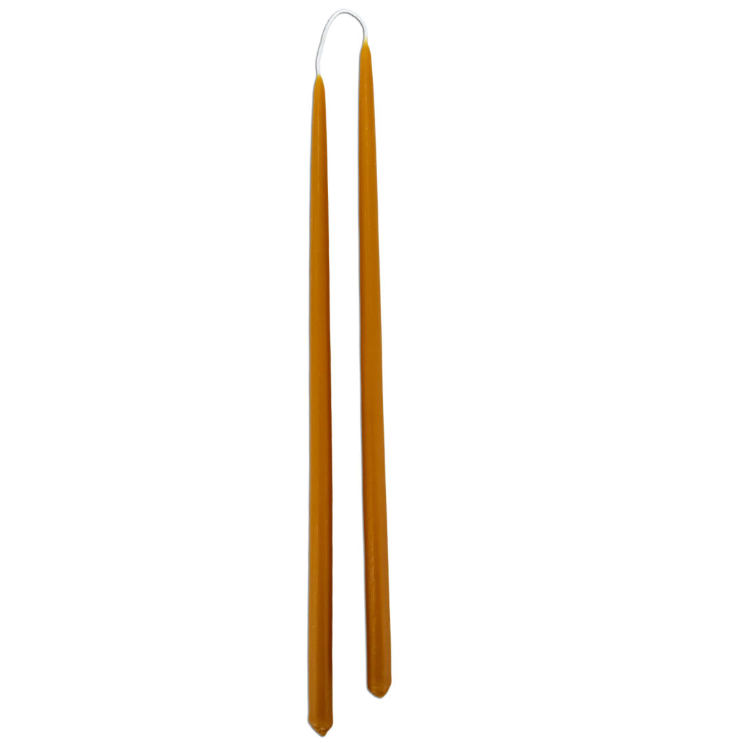 Thin taper beeswax candles hand-dipped  in Ochre for an elevated  design spaces