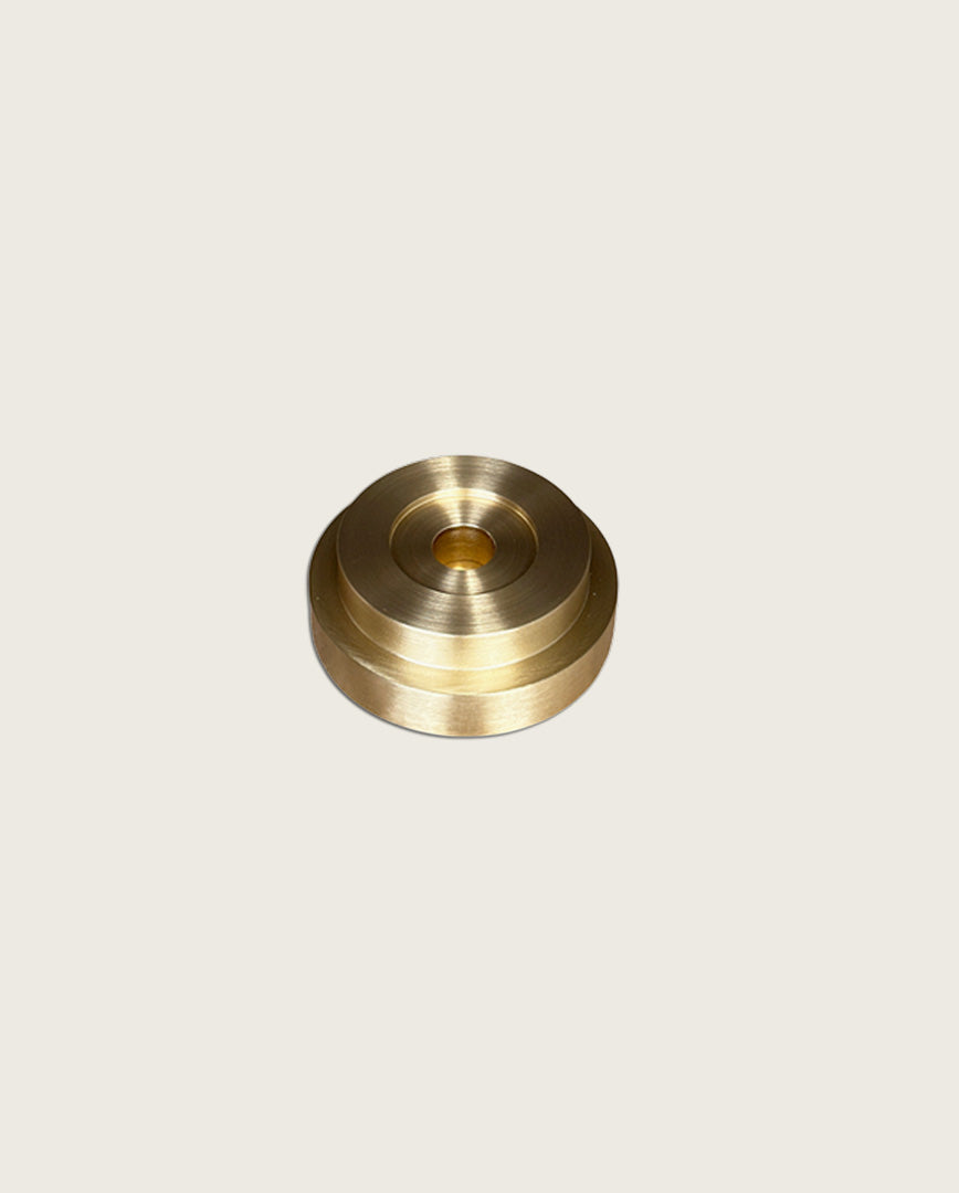 GLŌAM thin taper golden brass holder, a sculptural minimalist brass base made for Thin beeswax tapers, solid polished brass