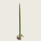 GLŌAM thin taper golden brass holder, a sculptural minimalist brass base made for Thin beeswax tapers, solid polished brass